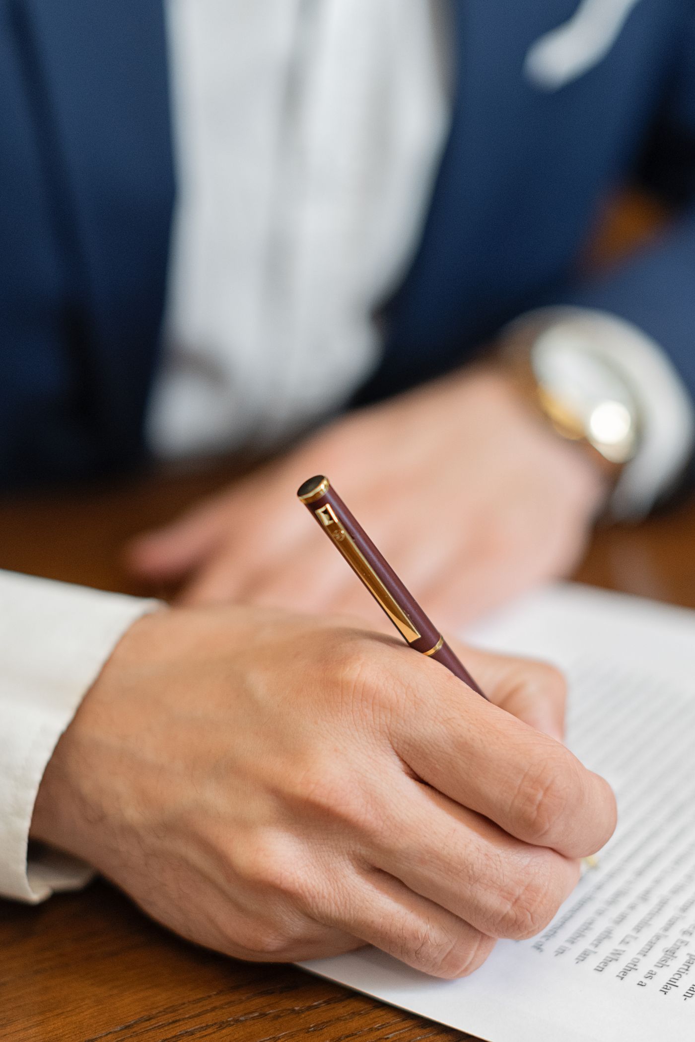 Professional attorney signing legal documents